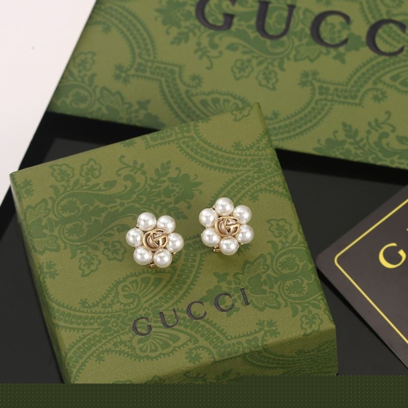 G*u*i earrings